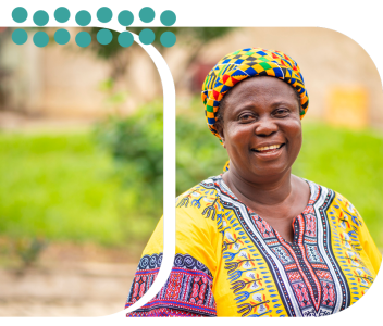 A smiling woman in colorful traditional clothing stands outdoors, symbolizing community leadership, health, and well-being. Photo © CIVIC