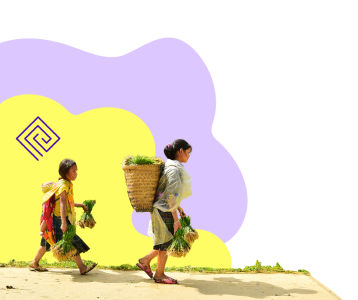 two young farmers walking and carrying crops