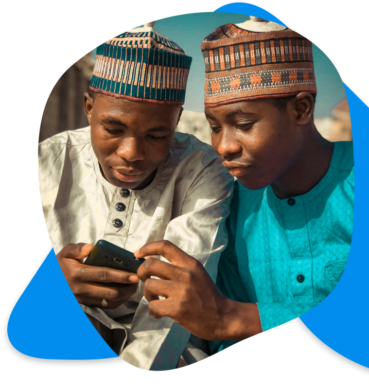 Two young men using technology
